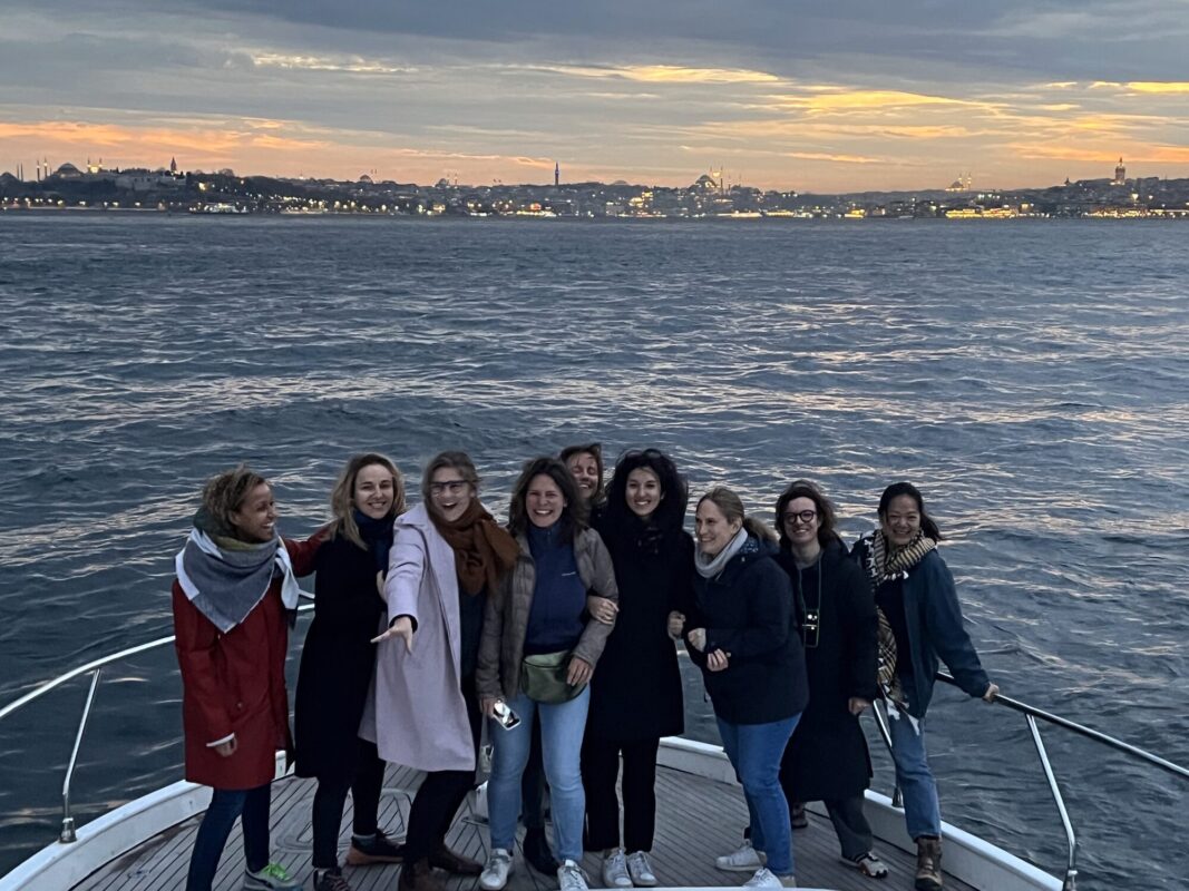 Bachelorette group on the yacht bow with the Bosphorus skyline behind