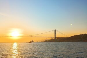 Bosphorus Bridge and sunset over the sea from a private yacht