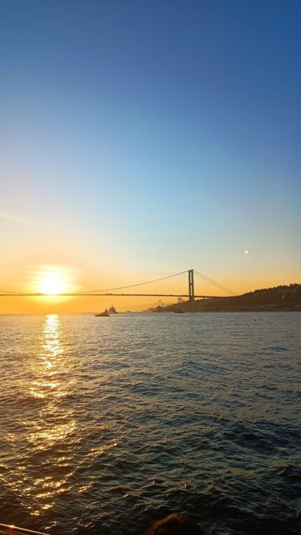 Bosphorus Bridge and sunset over the sea from a private yacht