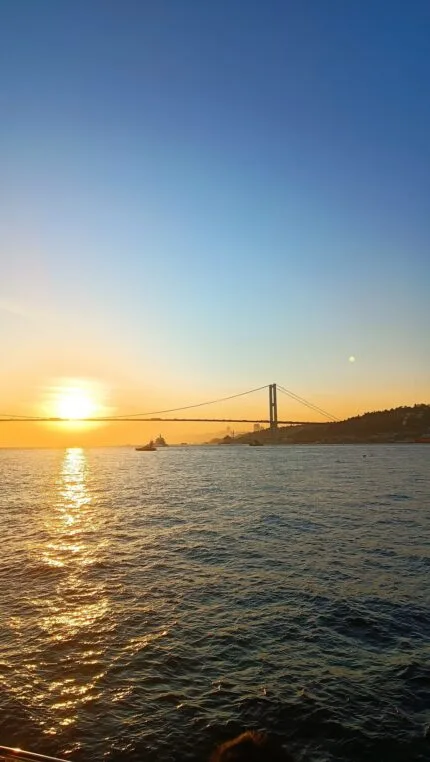 Bosphorus Bridge and sunset over the sea from a private yacht