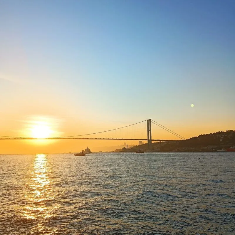 Bosphorus Bridge and sunset over the sea from a private yacht