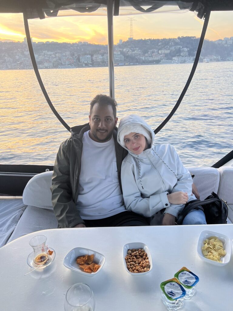 Couple enjoying refreshments in the yacht lounge on a Bosphorus cruise