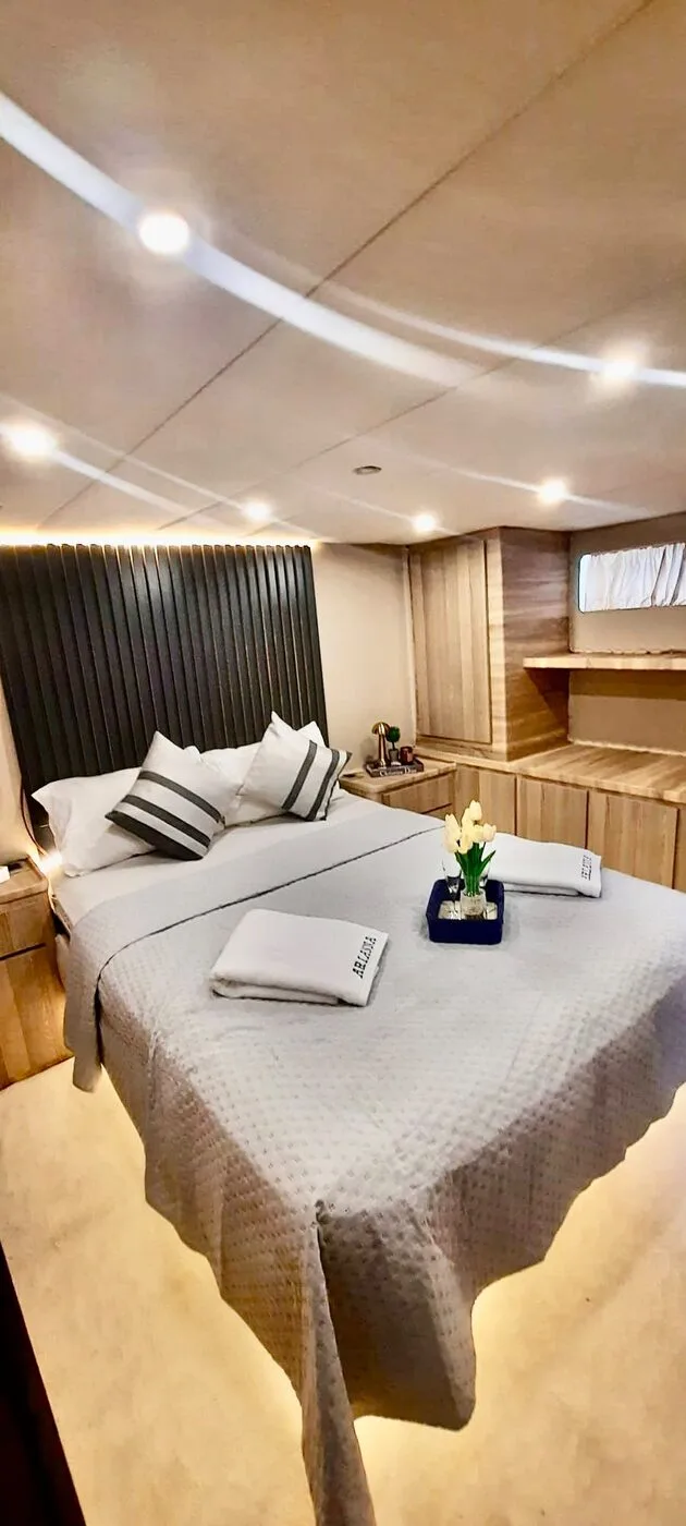 Guest cabin with a double bed and fresh towels