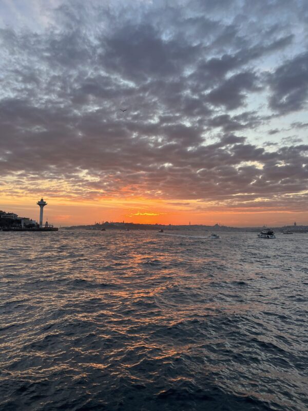 Dramatic sunset clouds over the Bosphorus during a yacht cruise