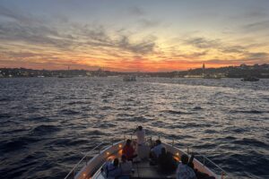 Evening city lights of Istanbul seen from a private yacht cruise