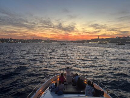 Evening city lights of Istanbul seen from a private yacht cruise