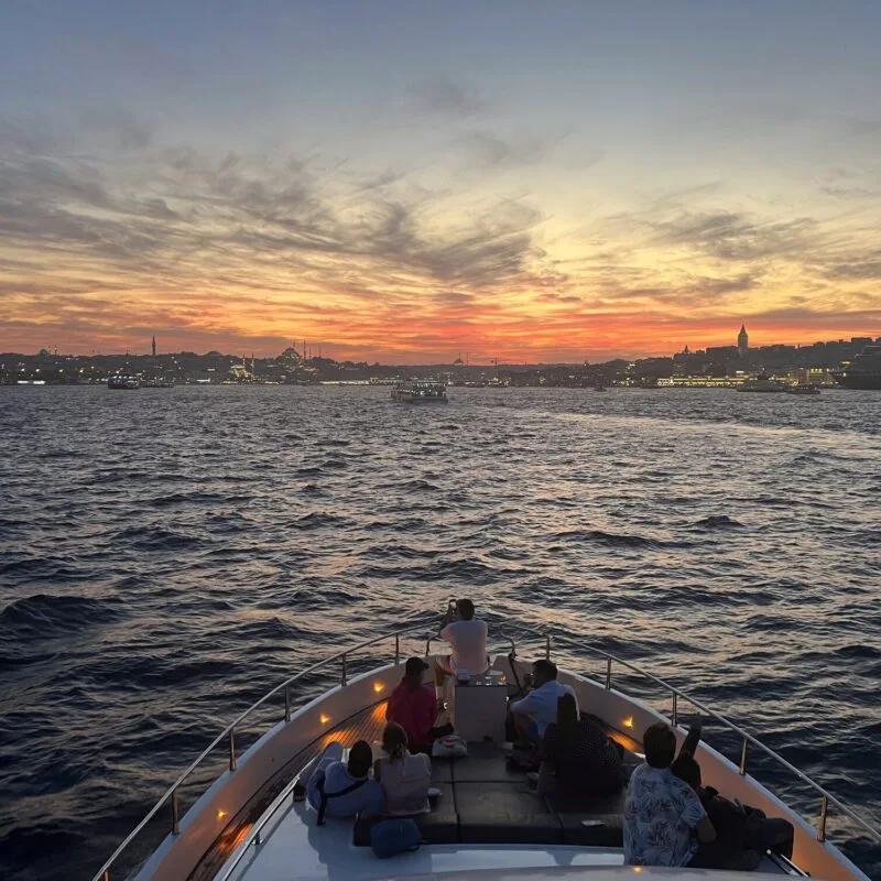 Evening city lights of Istanbul seen from a private yacht cruise