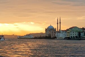 Ortakoy Mosque at sunset seen from a yacht on the Bosphorus