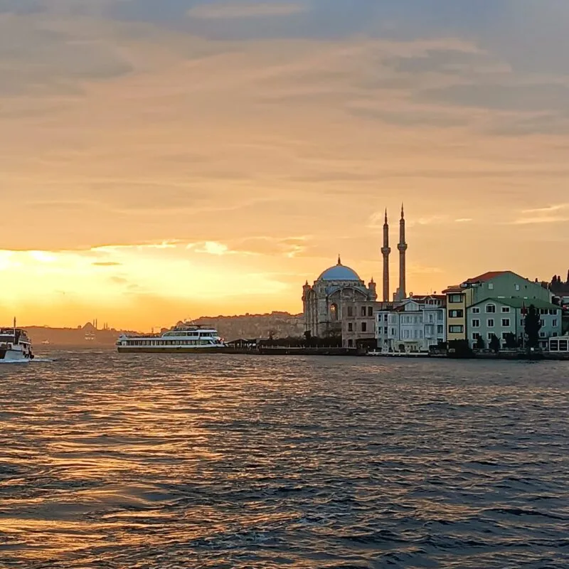 Ortakoy Mosque at sunset seen from a yacht on the Bosphorus