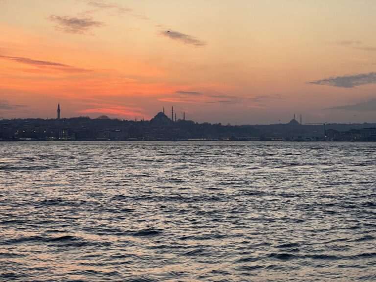 Suleymaniye Mosque skyline at sunset viewed from a yacht on the Bosphorus