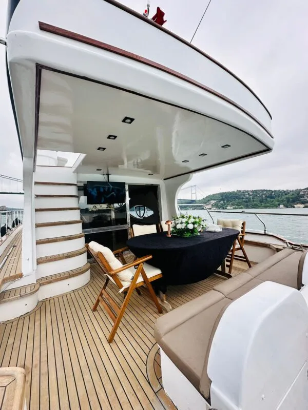 Dinner table set on the Tuana yacht deck, Bosphorus behind