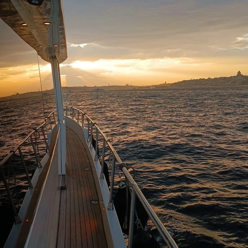Teak side deck of a luxury yacht with the sunset over the Bosphorus
